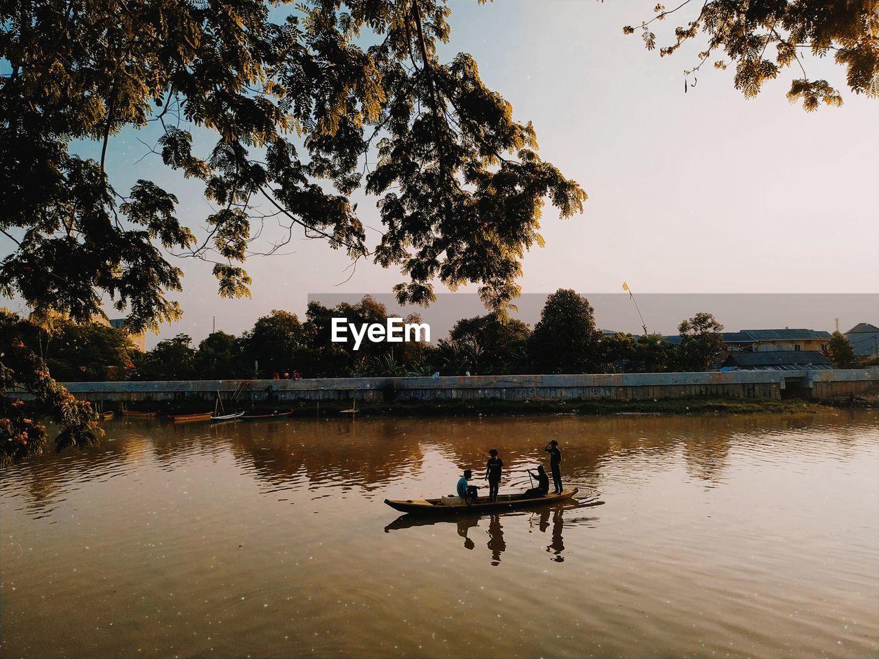 SCENIC VIEW OF LAKE AT SUNSET