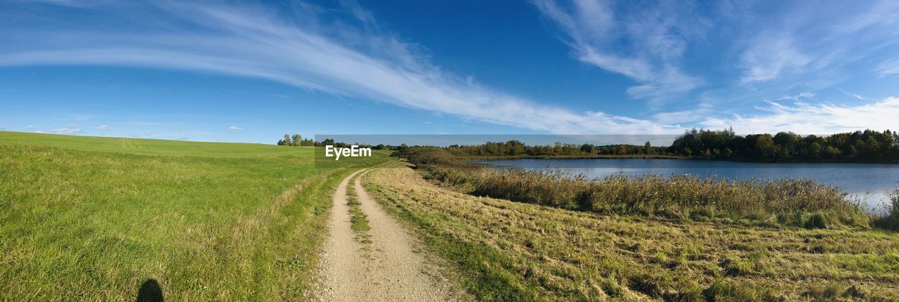 PANORAMIC VIEW OF LAND AGAINST SKY DURING SUNSET