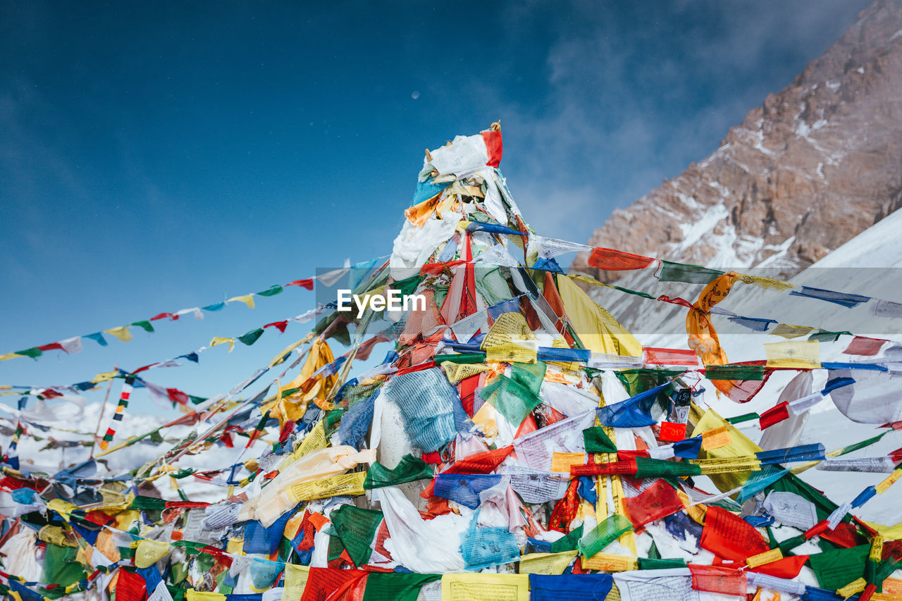 low angle view of multi colored flags