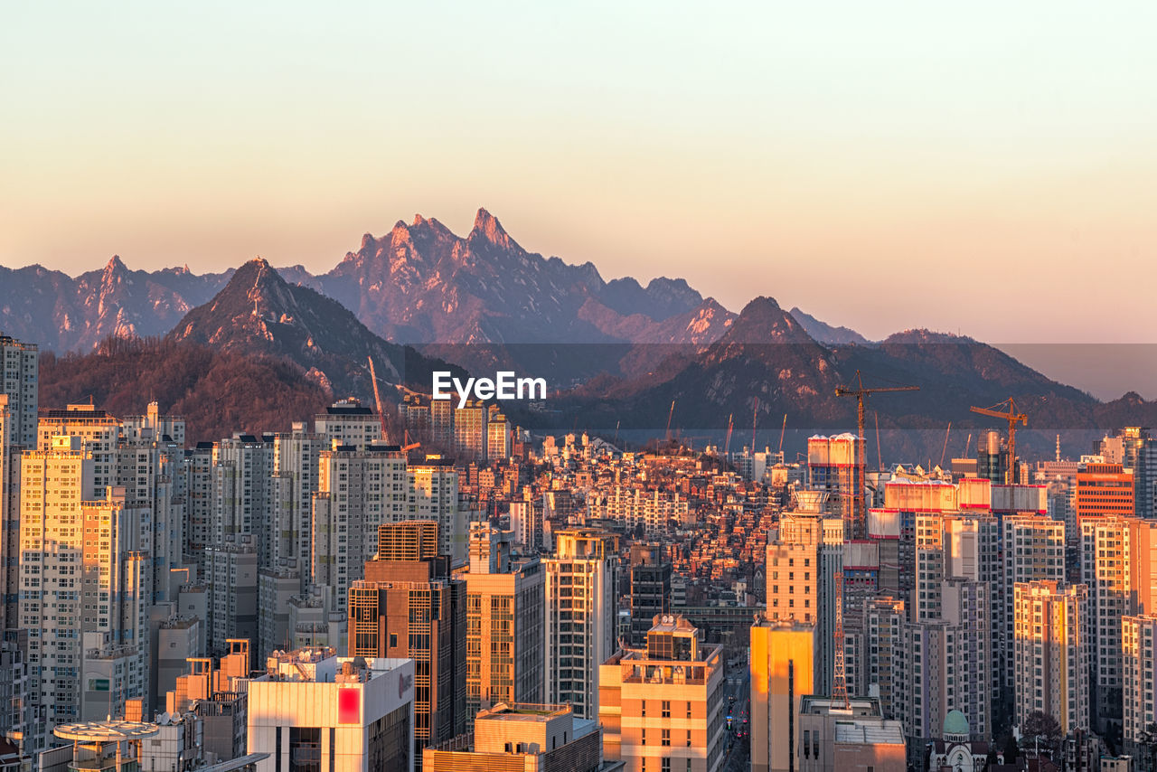 View of cityscape against sky during sunset