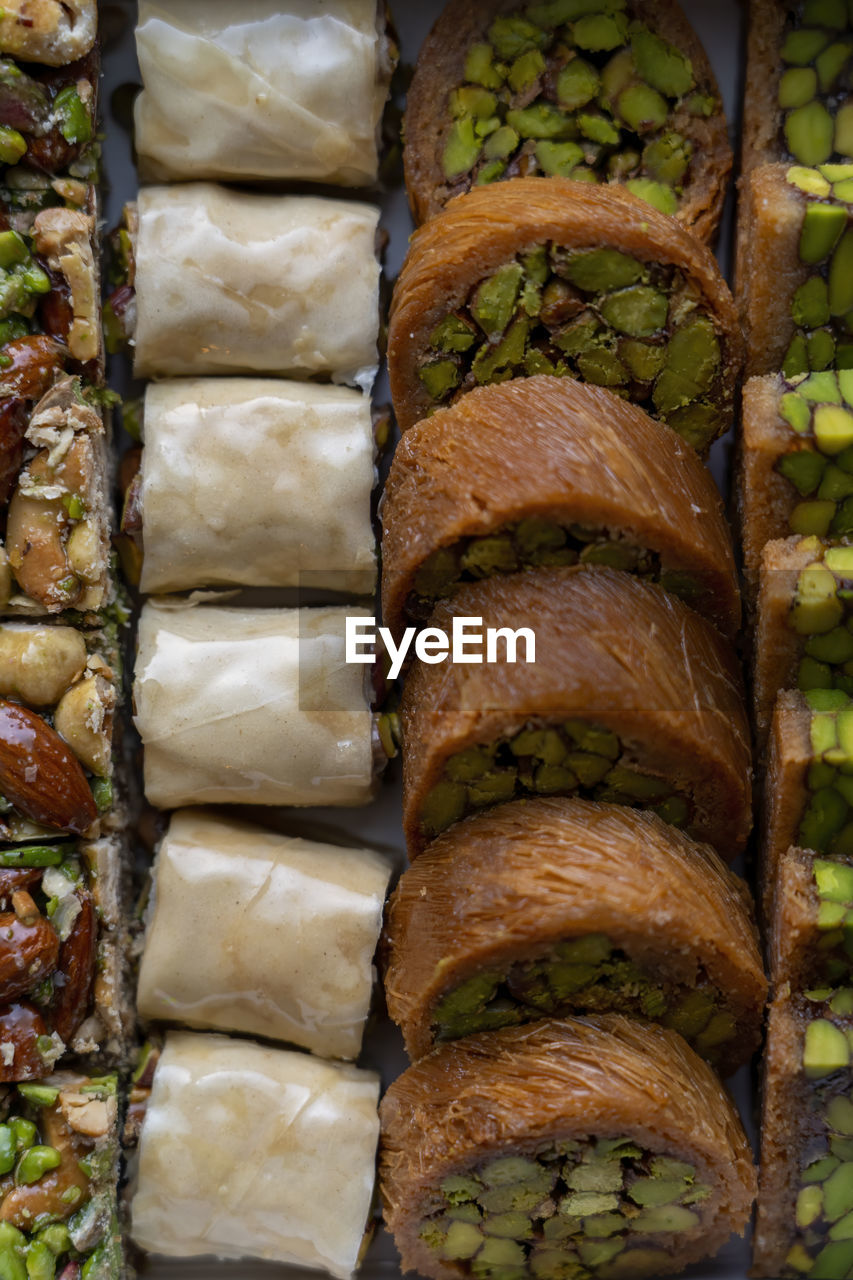 Arabic and turkish oriental sweets desserts made of pistachios and kunafa with leafy dough