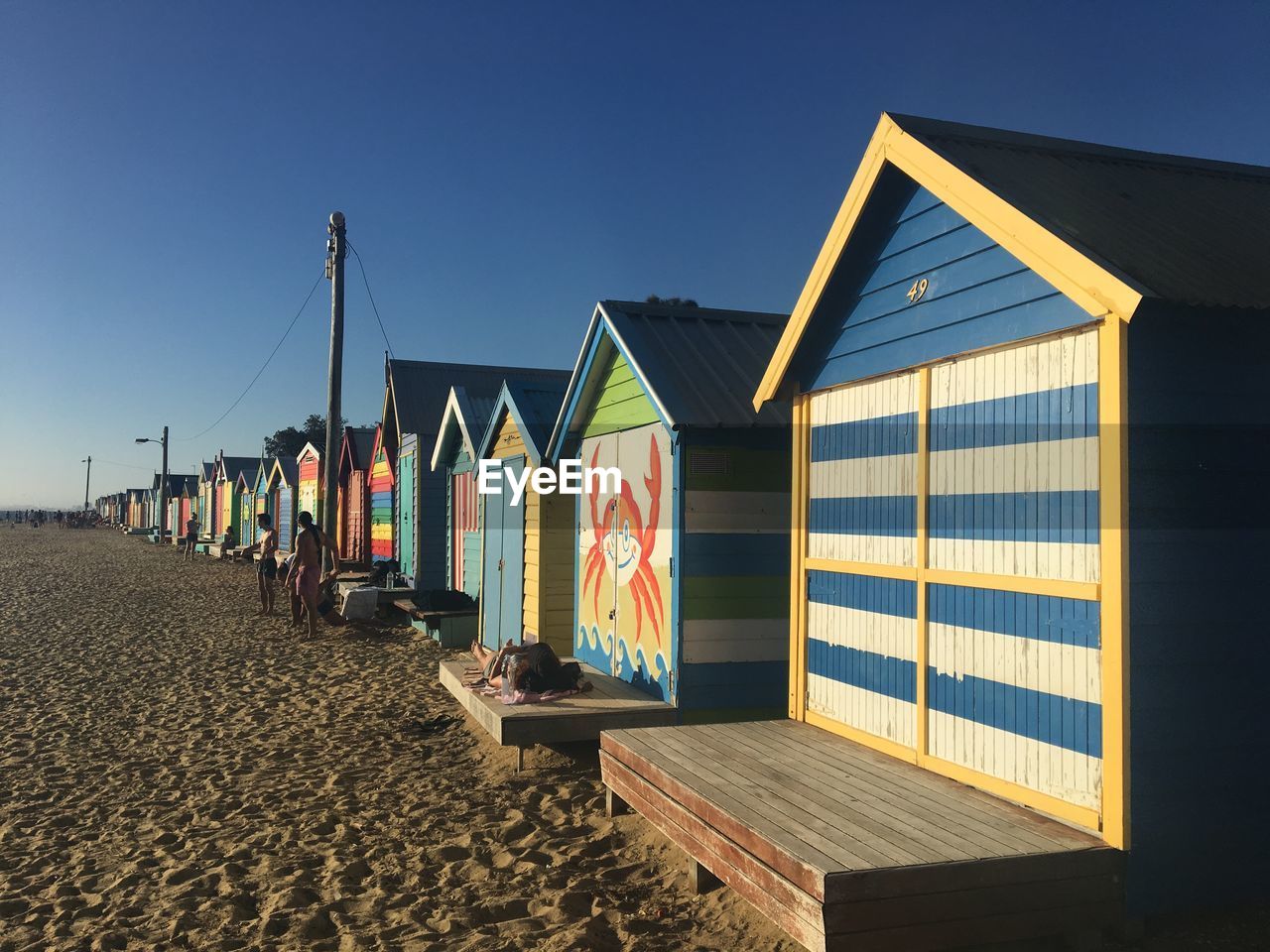BEACH HUTS AGAINST SKY
