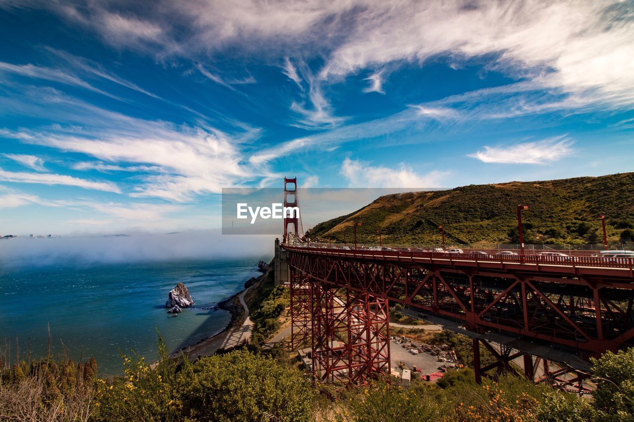 Golden gate bridge by sea against sky