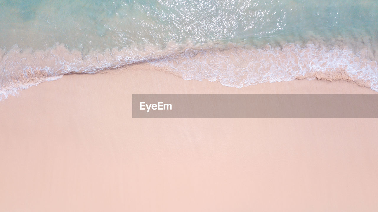 HIGH ANGLE VIEW OF WOMAN IN WATER