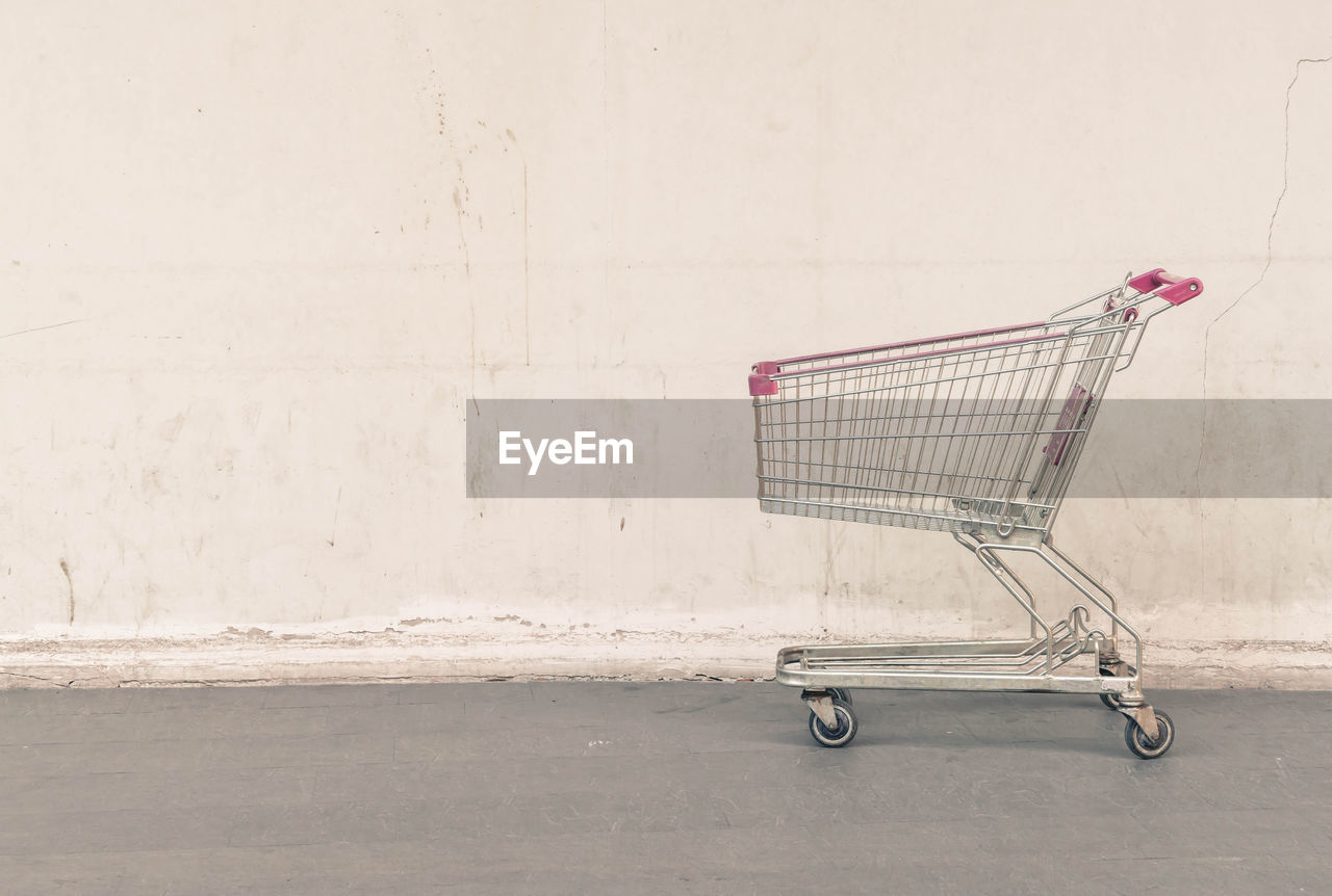 View of shopping cart against wall