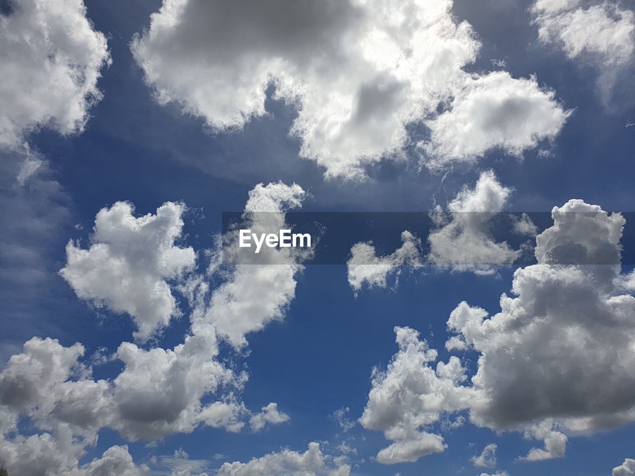 LOW ANGLE VIEW OF WHITE CLOUDS IN SKY