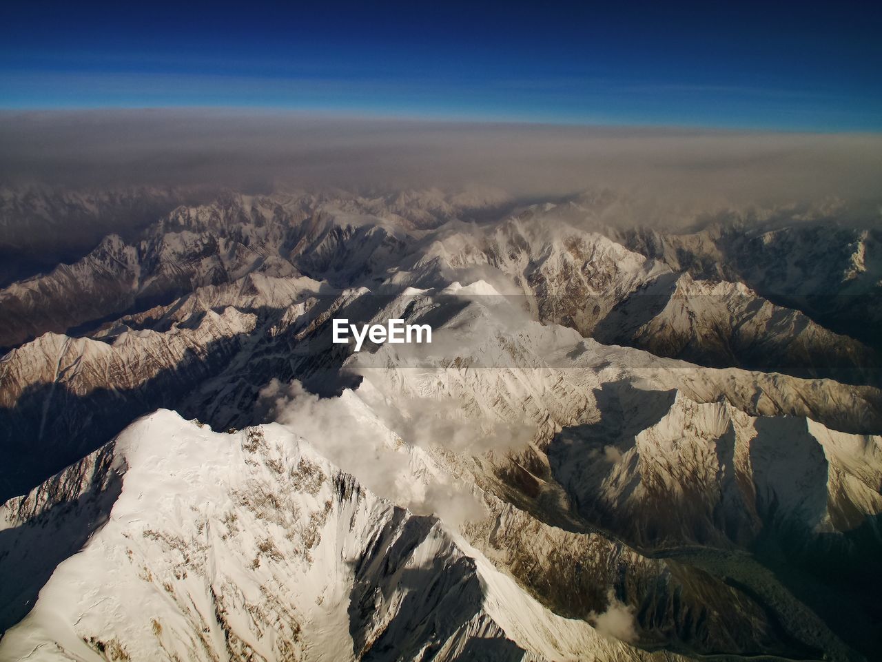 Aerial view of the himalayas against sky