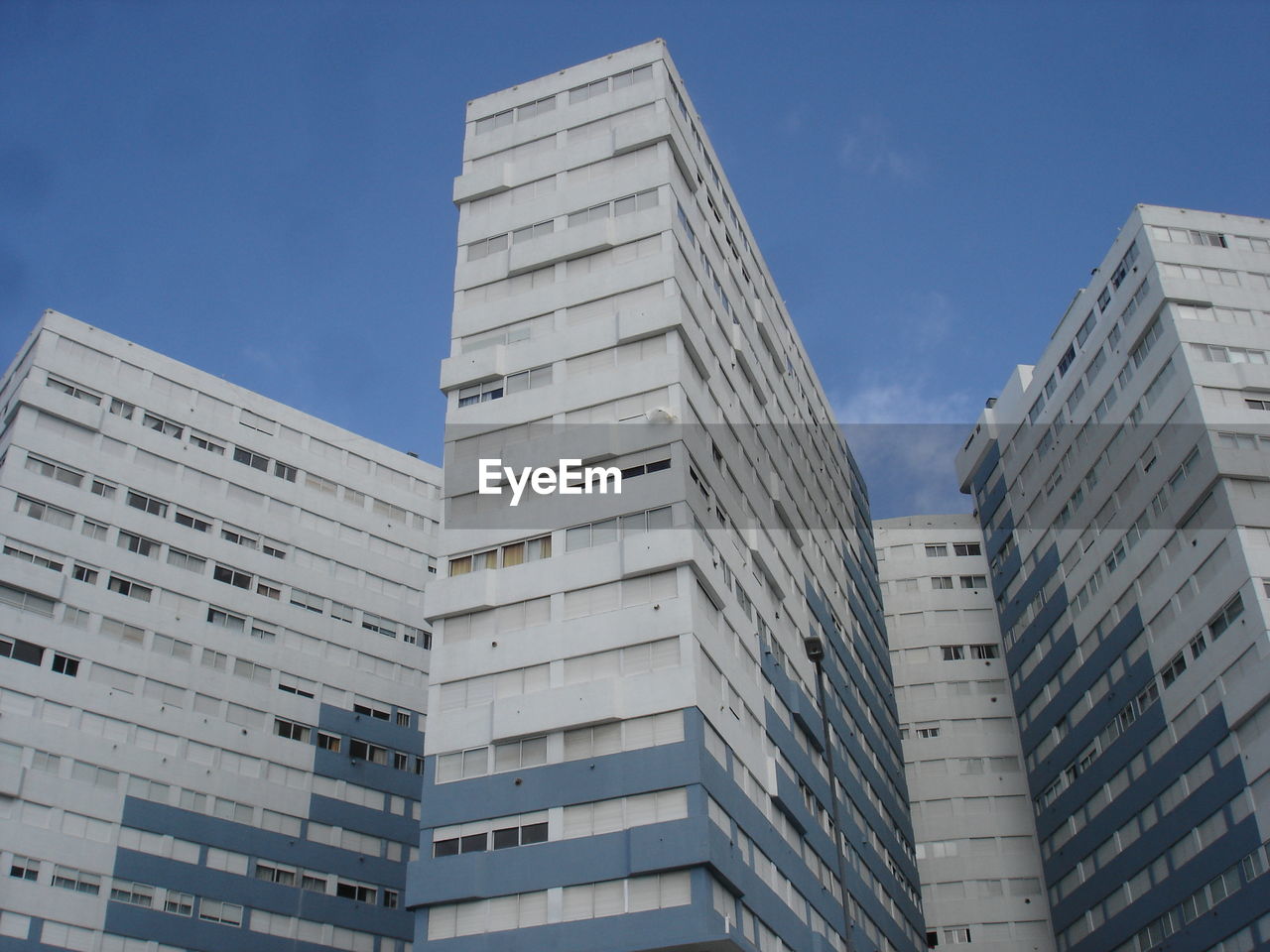 Low angle view of modern buildings against sky