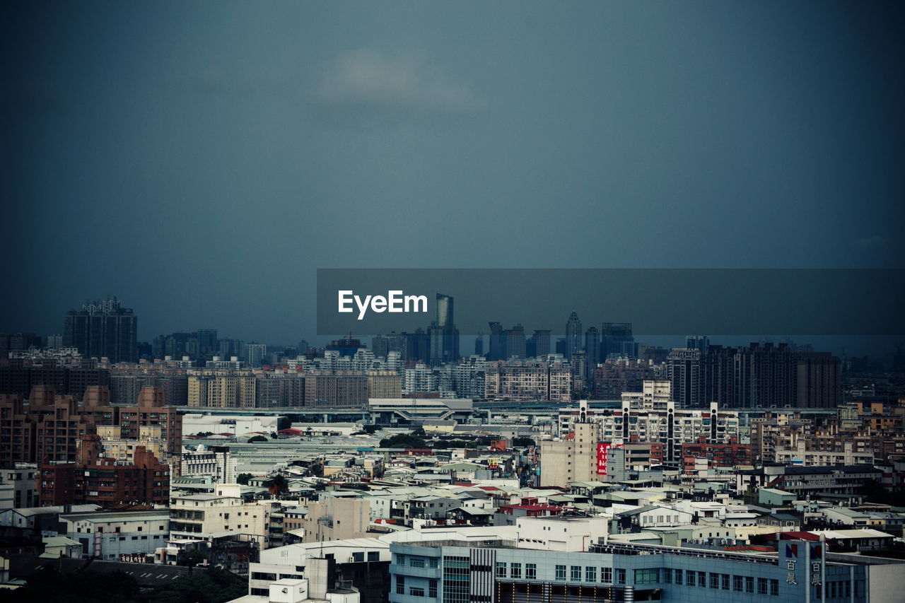 Buildings in city at dusk