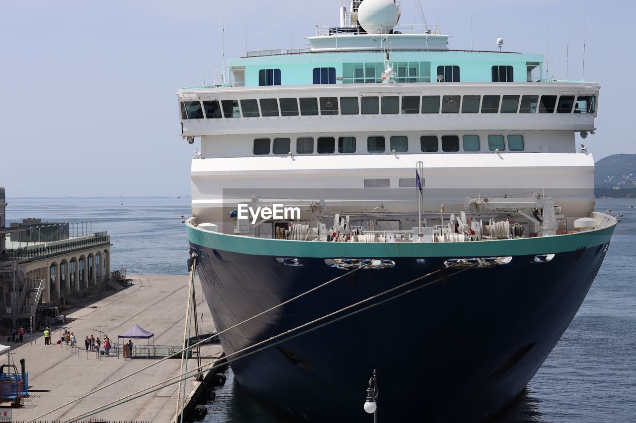 VIEW OF SHIP MOORED IN SEA AGAINST SKY