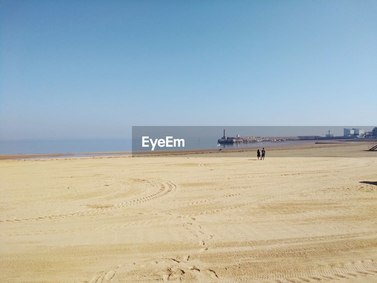 Scenic view of beach against clear sky