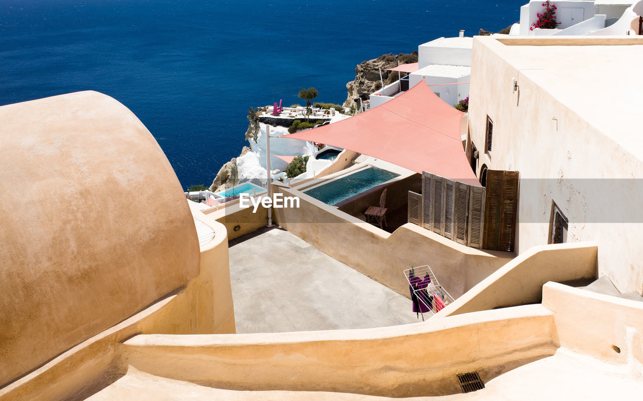 High angle view of houses by sea