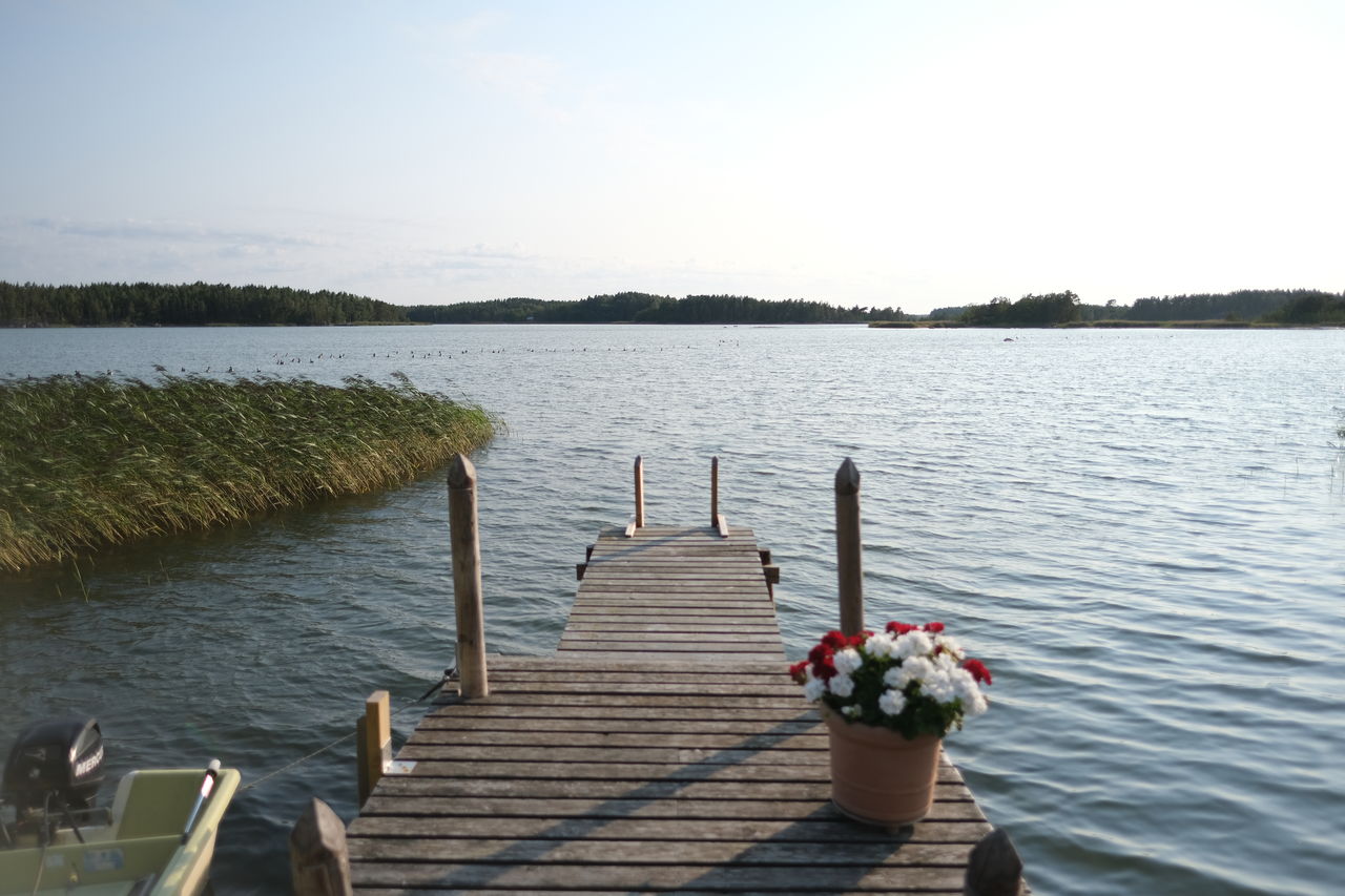 WOODEN PIER OVER LAKE