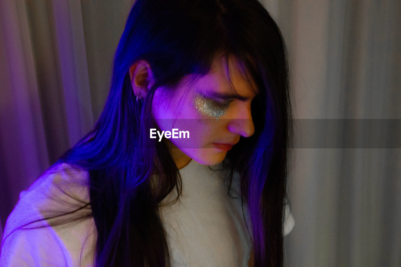 Close-up of man with make up on face