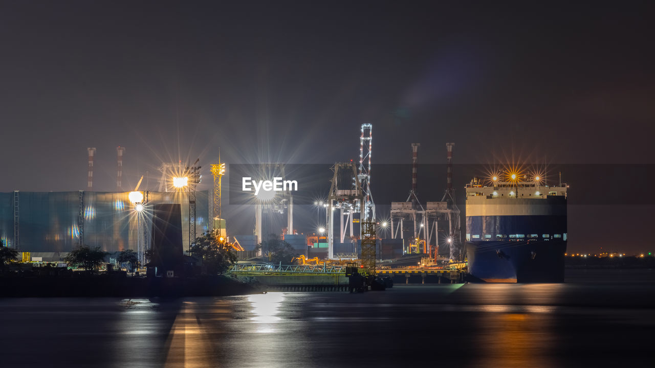 Night scene shot shipping port and factory area