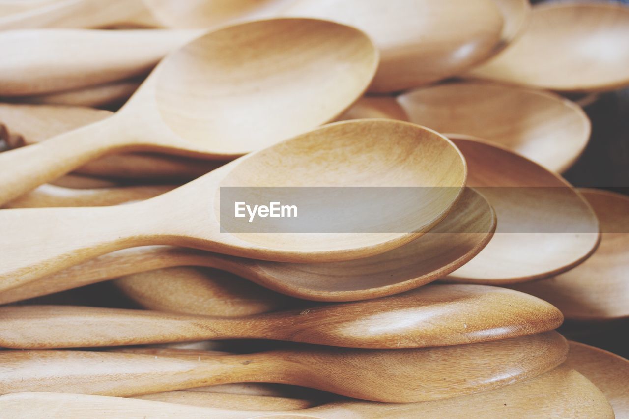 Full frame shot of stacked wooden spoons