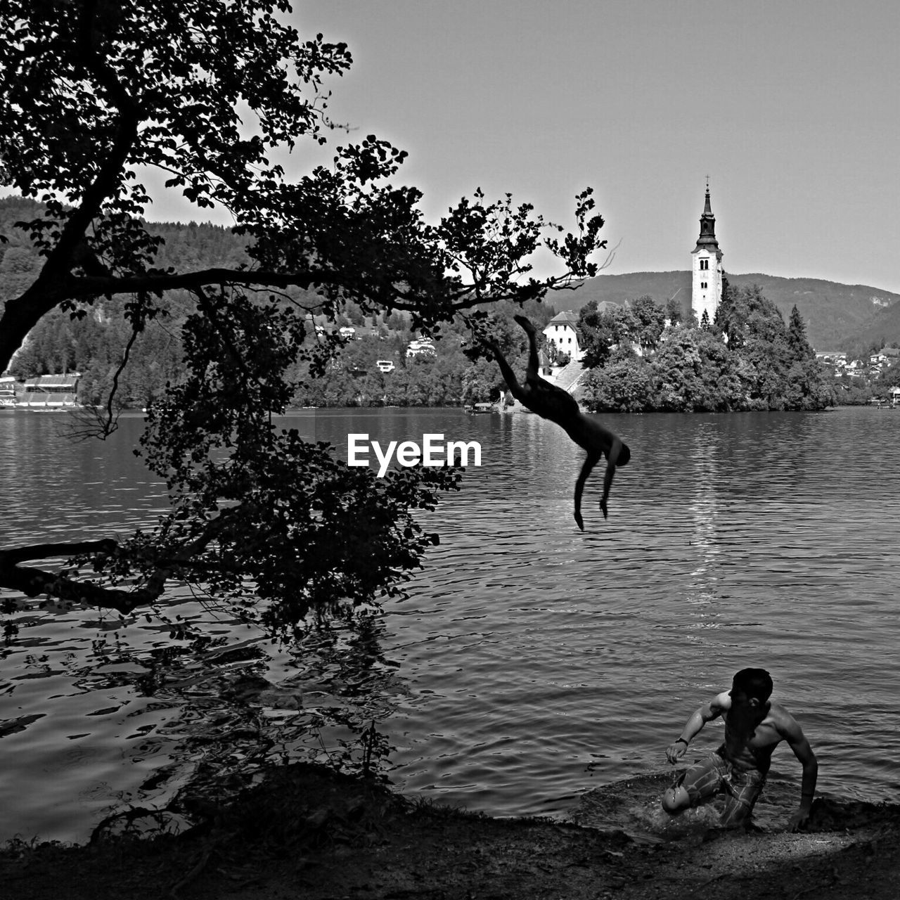 Man jumping in lake