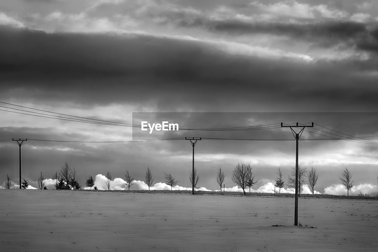 PANORAMIC SHOT OF ELECTRICITY PYLON AGAINST SKY