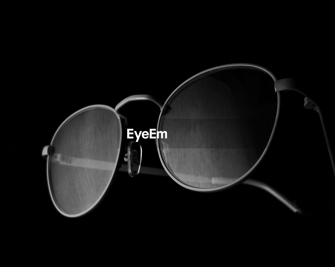 Close-up of sunglasses against black background