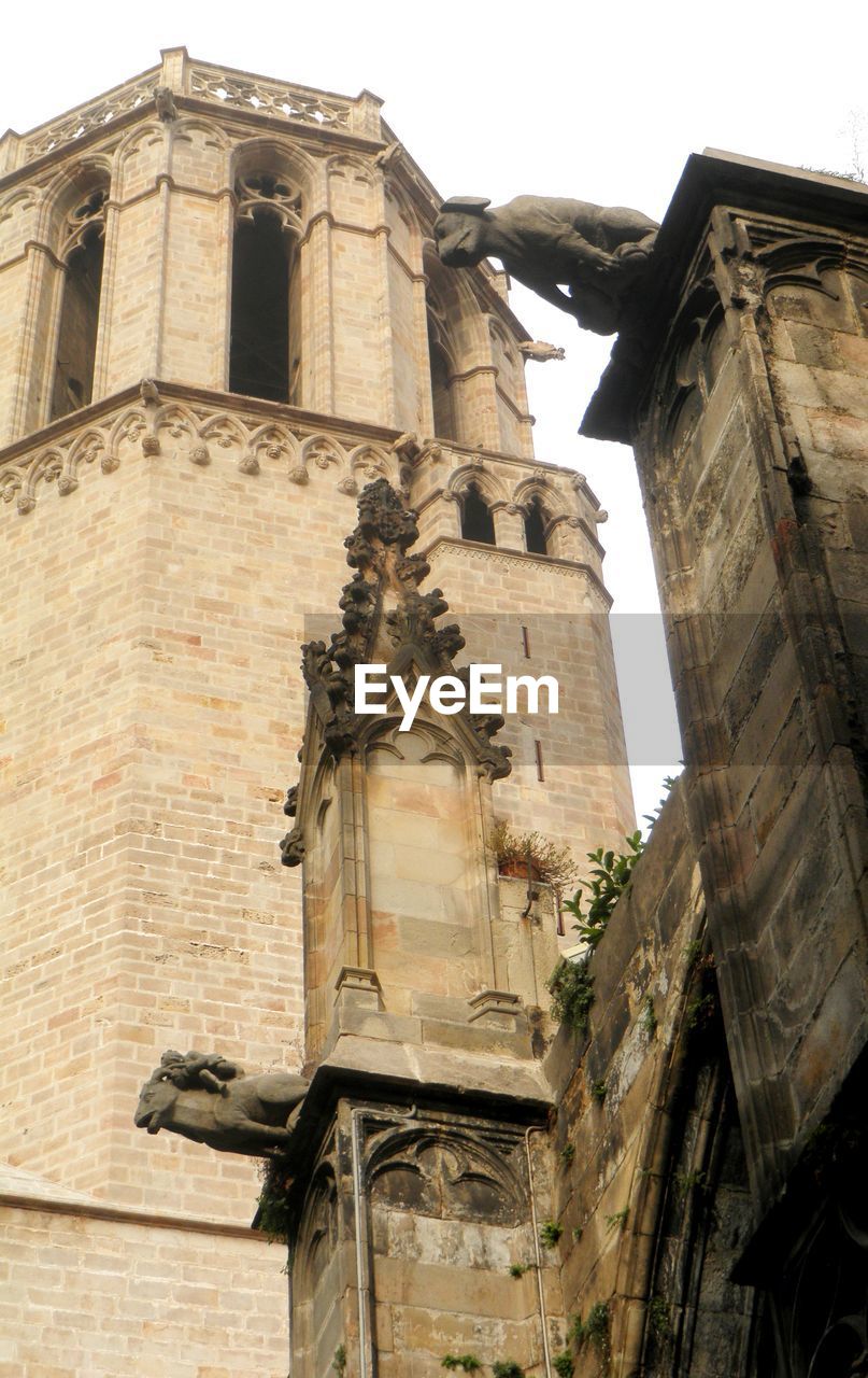 Low angle view of bell tower against sky