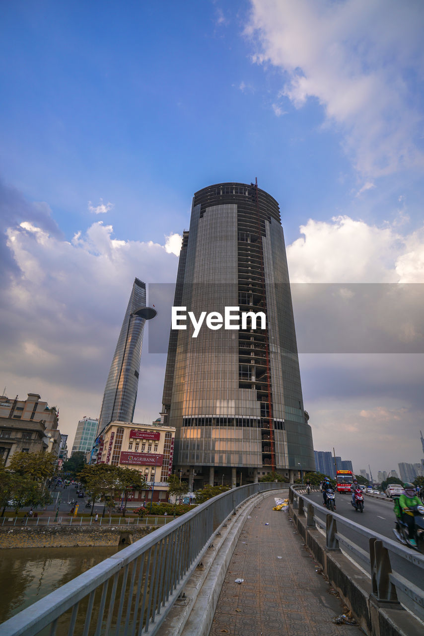 ROAD BY BUILDING AGAINST SKY IN CITY