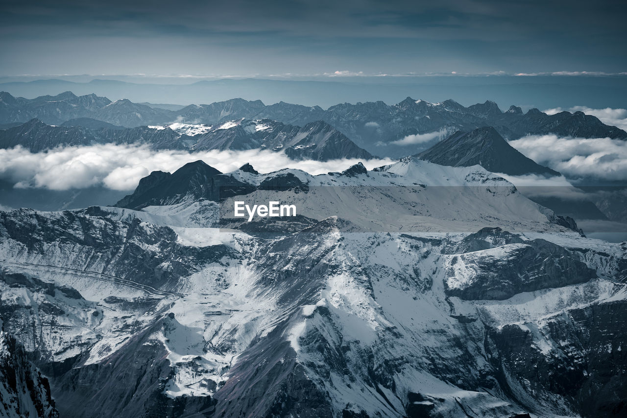 Scenic view of snowcapped mountains against sky