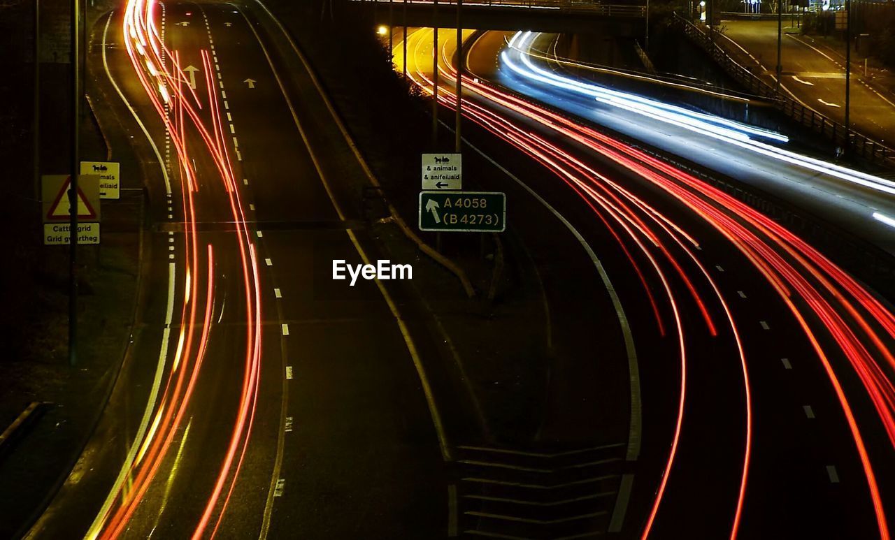 Light trails on highway in city at night