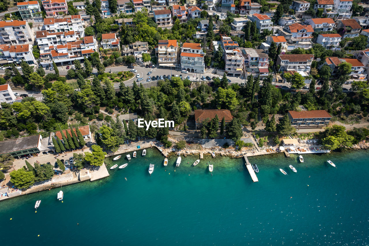 high angle view of townscape by sea