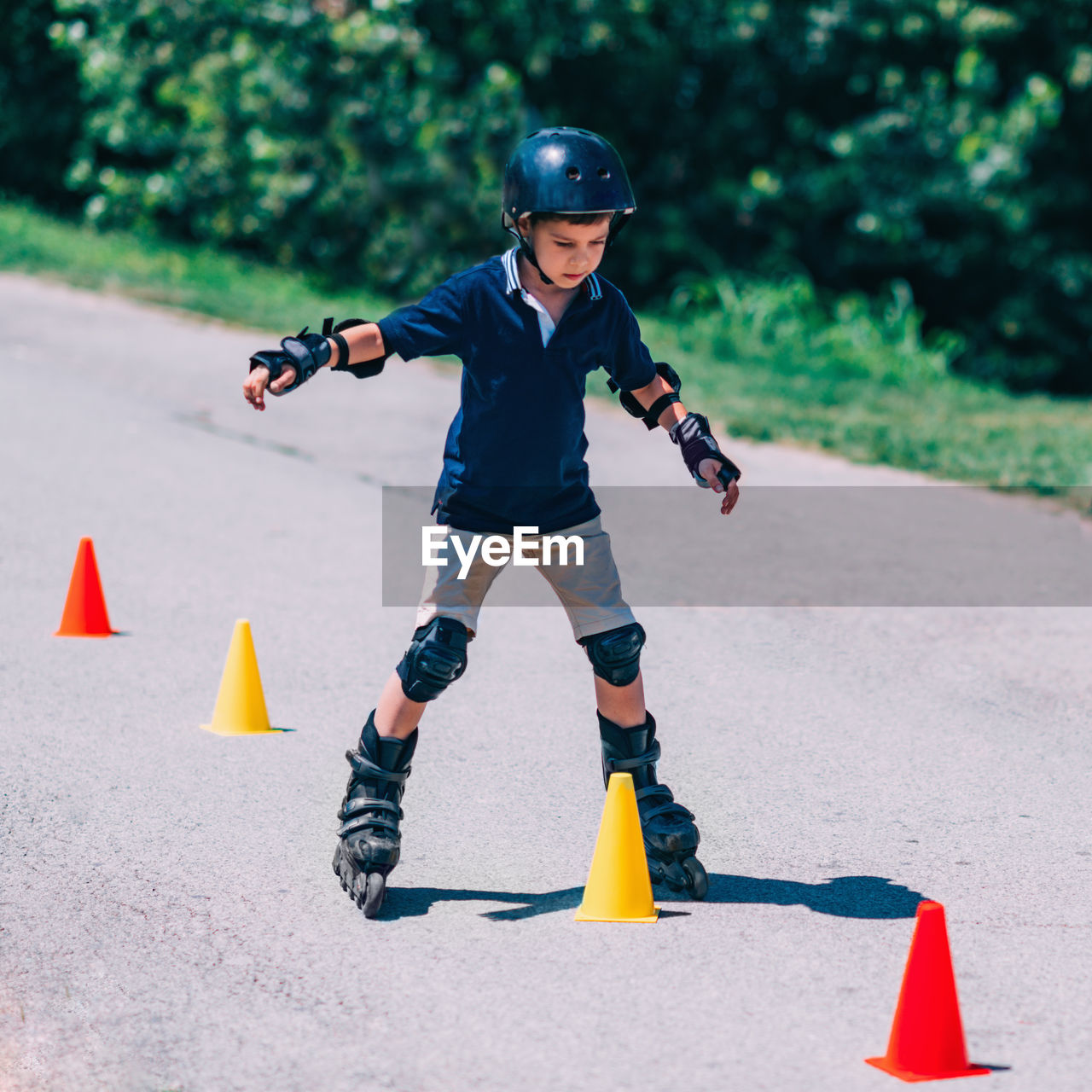 Boy rollerblading at park