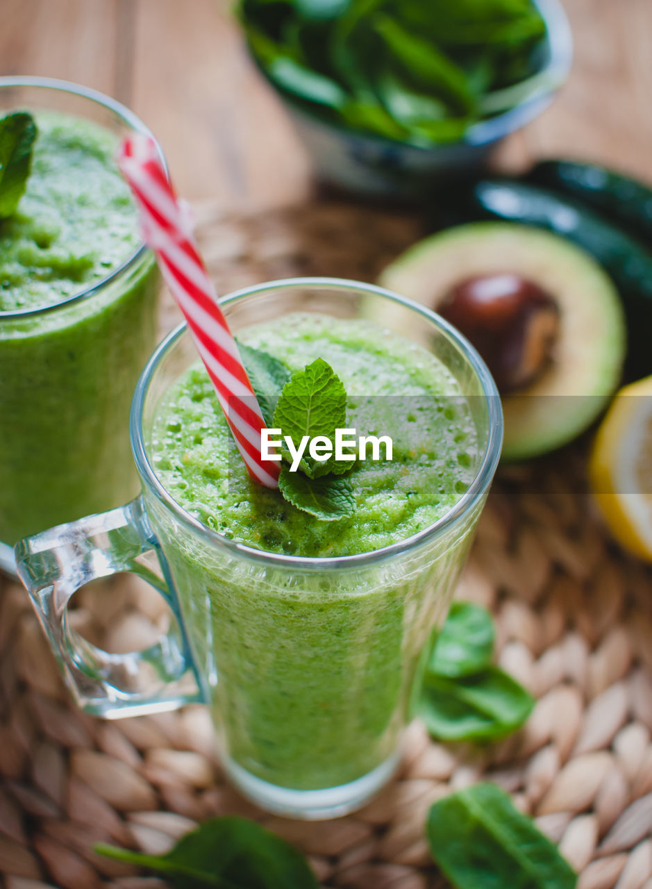 Close-up of green smoothie in a glass with fresh mint