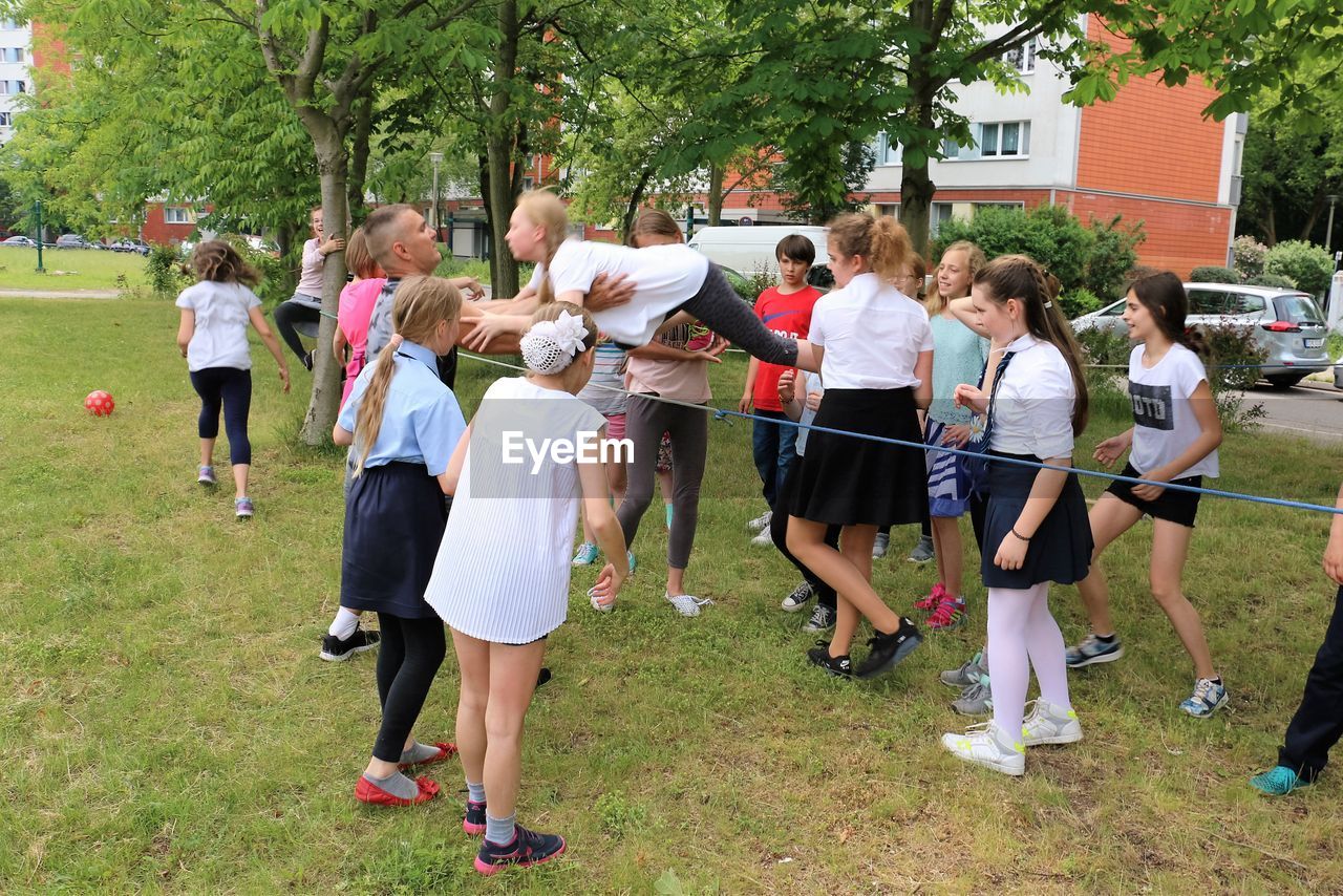 CHILDREN PLAYING IN PARK