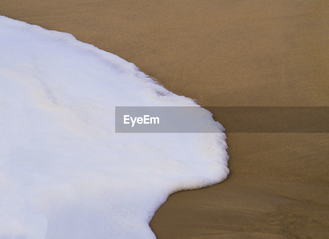 CLOSE UP OF SAND ON SHORE