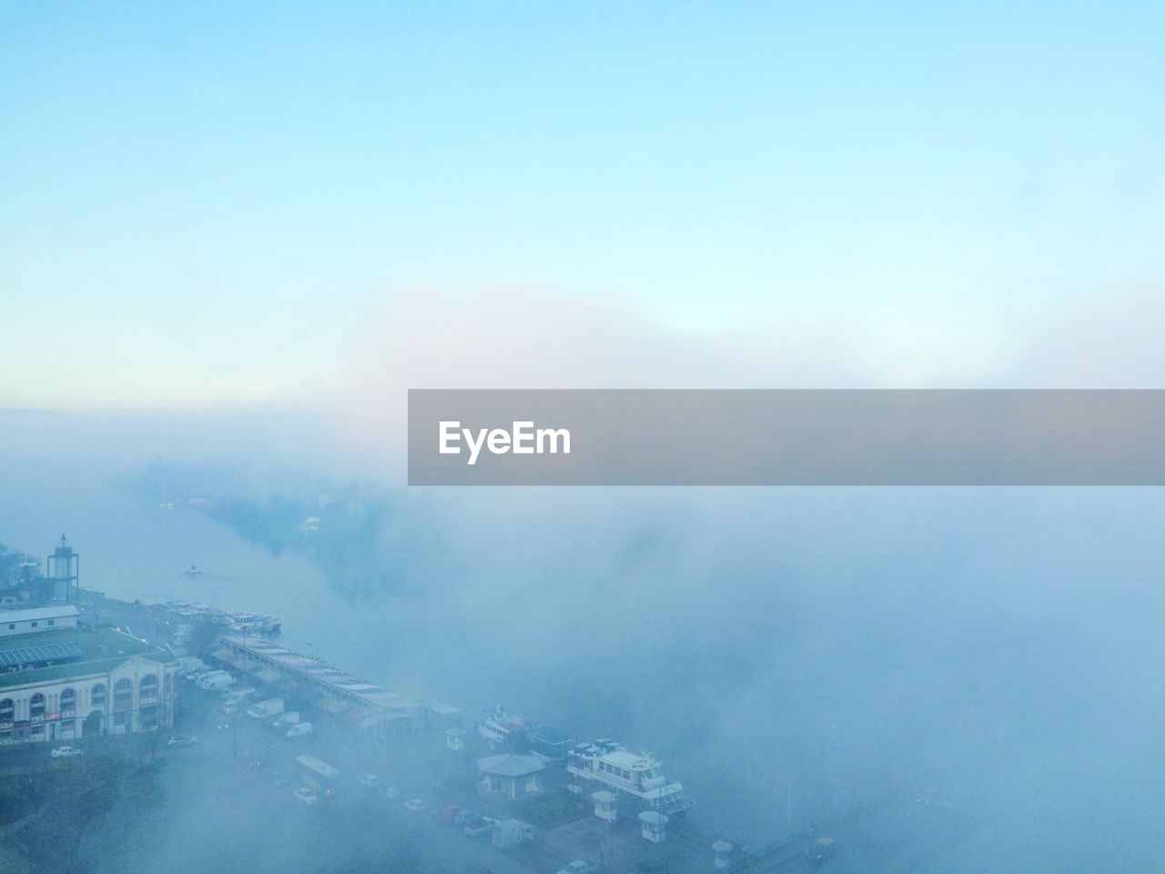 Aerial view of city against sky during winter