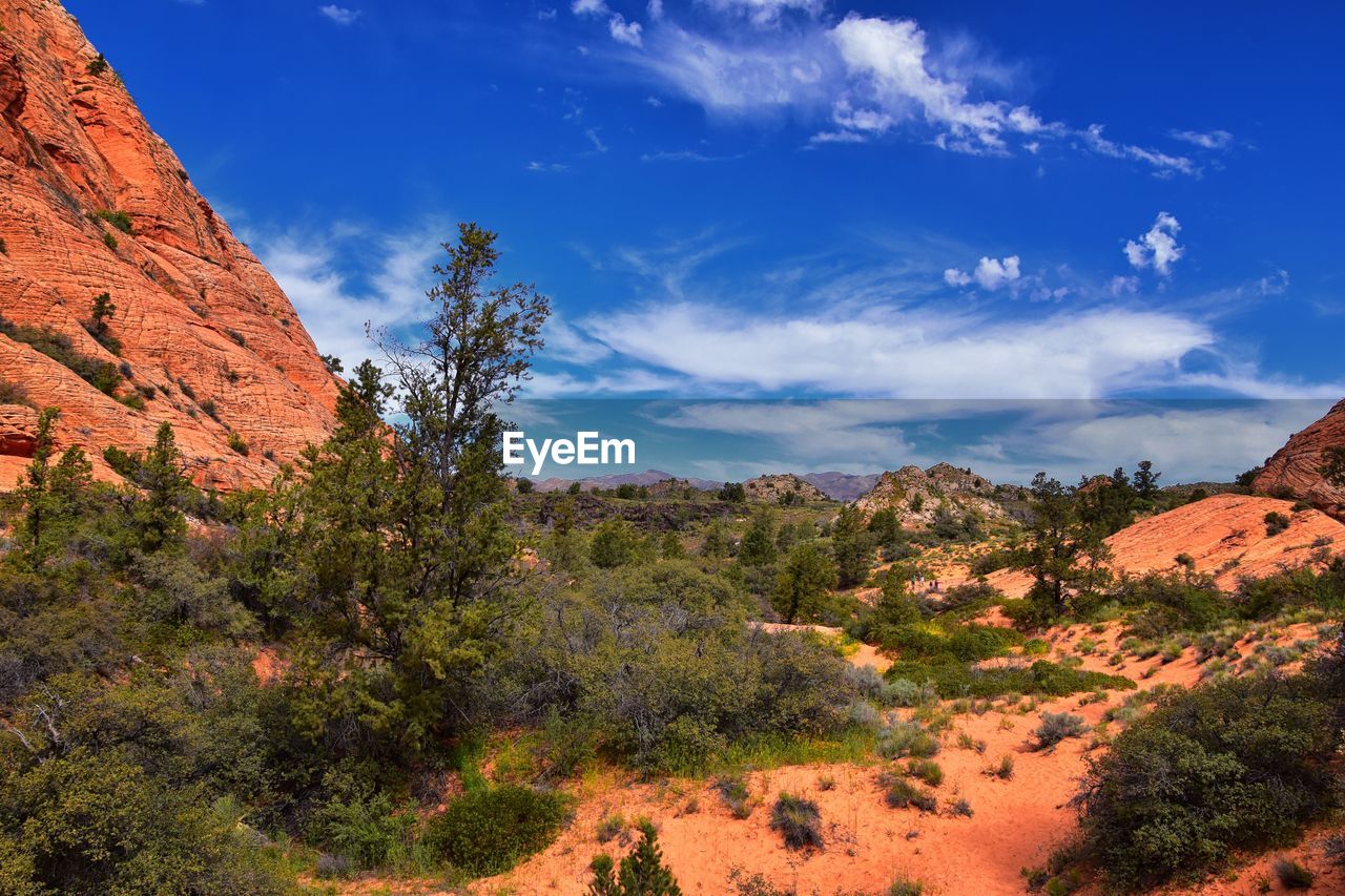 Scenic view of mountain against blue sky