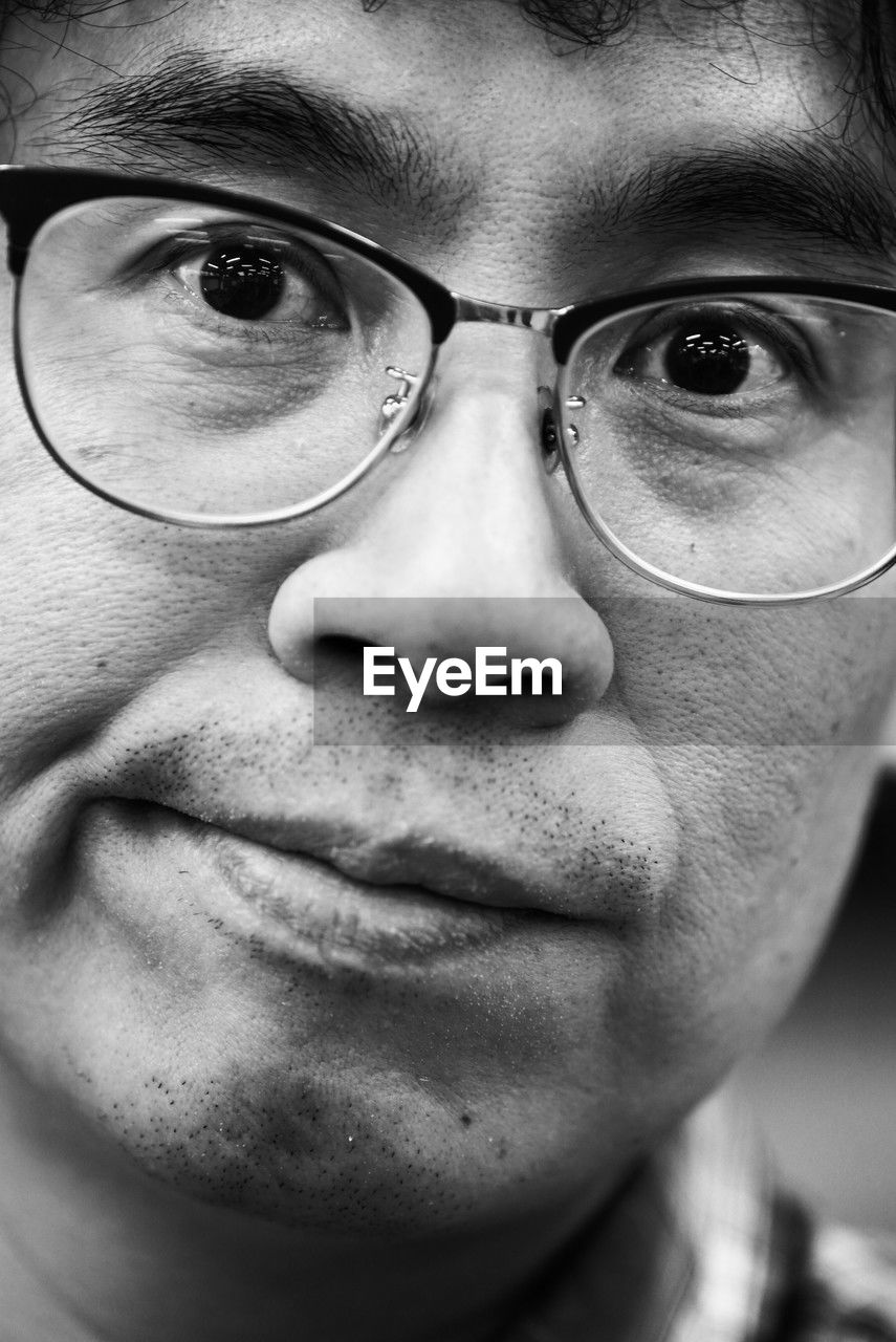 eyeglasses, portrait, glasses, close-up, vision care, human face, one person, adult, black and white, portrait photography, black, monochrome, white, headshot, men, looking at camera, monochrome photography, eyewear, person, human head, human eye, serious, front view, emotion, nose, facial expression, young adult, looking, intelligence
