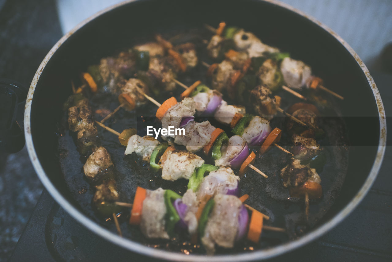 High angle view of chicken cooking in pan