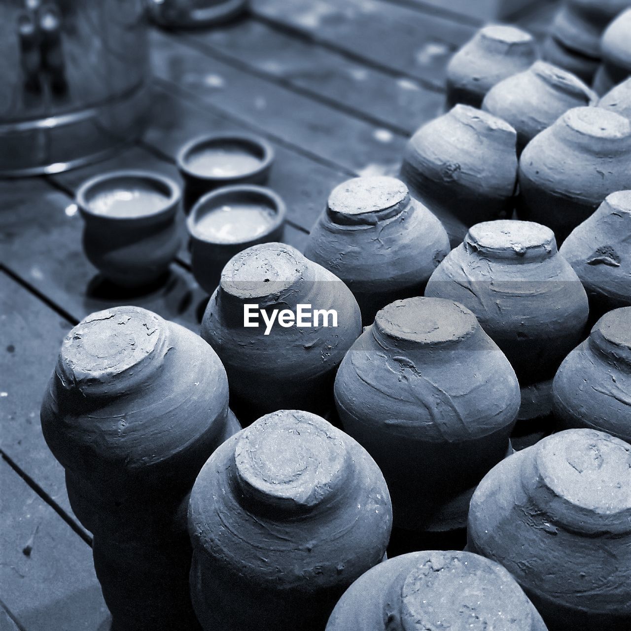 High angle view of earthenware on floorboard