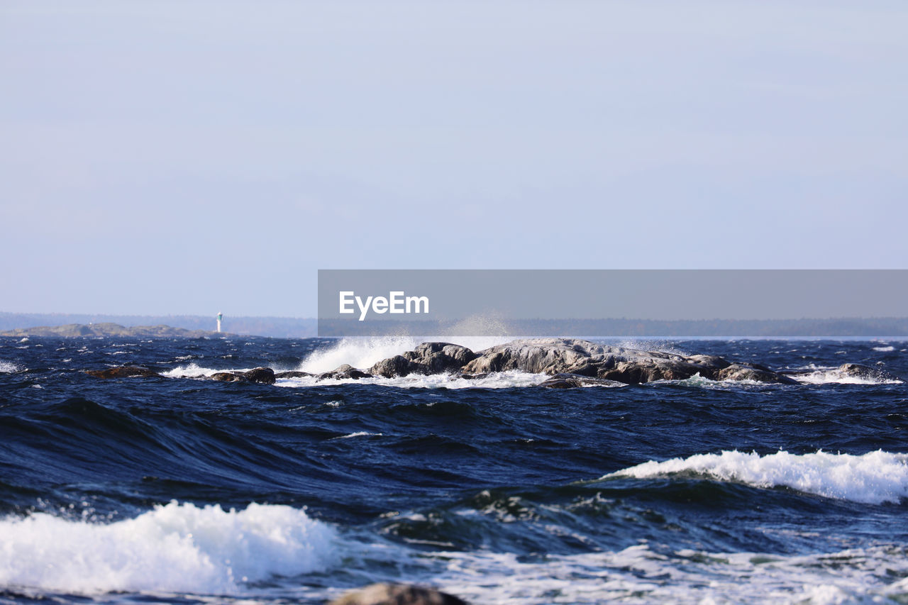 Scenic view of sea against clear sky