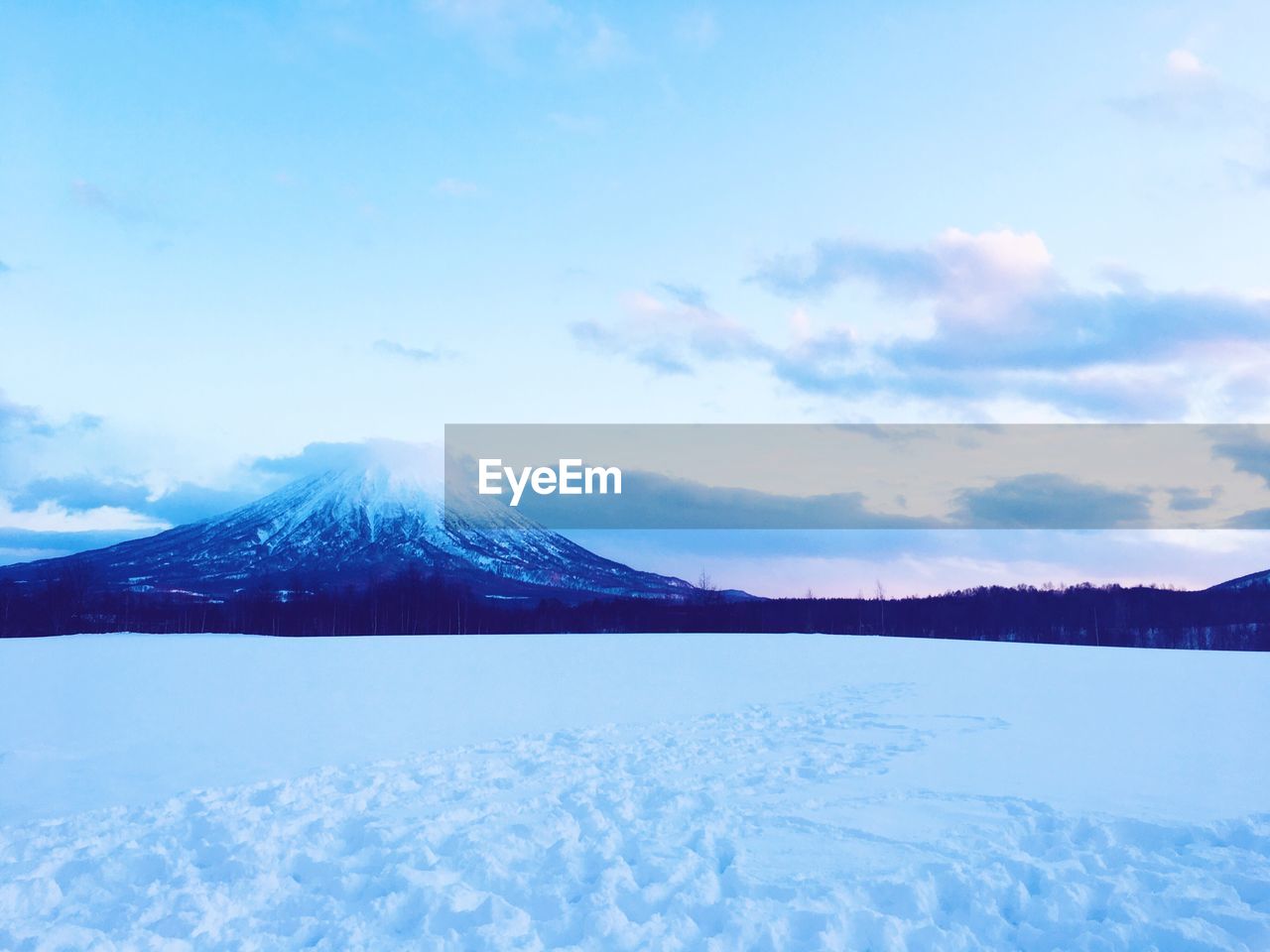 Scenic view of mountains against sky during winter