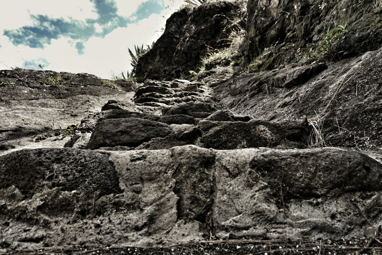 Low angle view of rock formation against sky