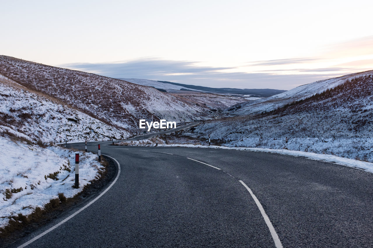 Scenic view of mountains against sky during winter