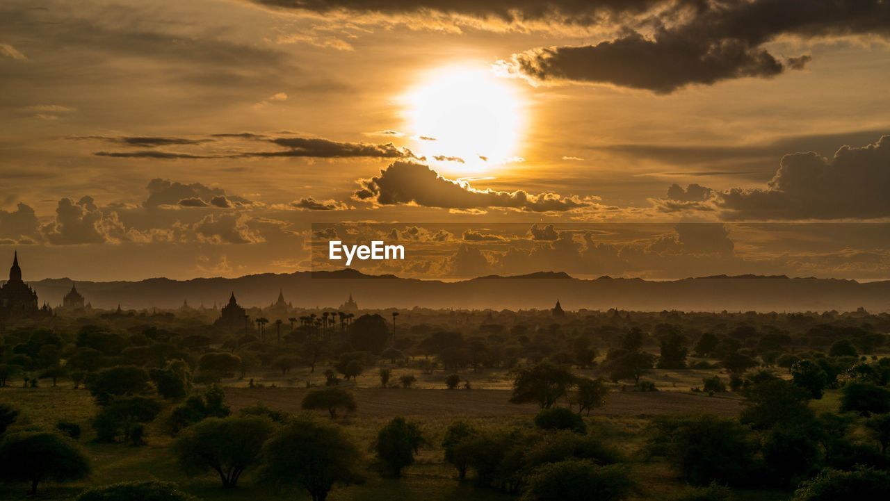 Scenic view bagan archaeological zone against sky during sunset