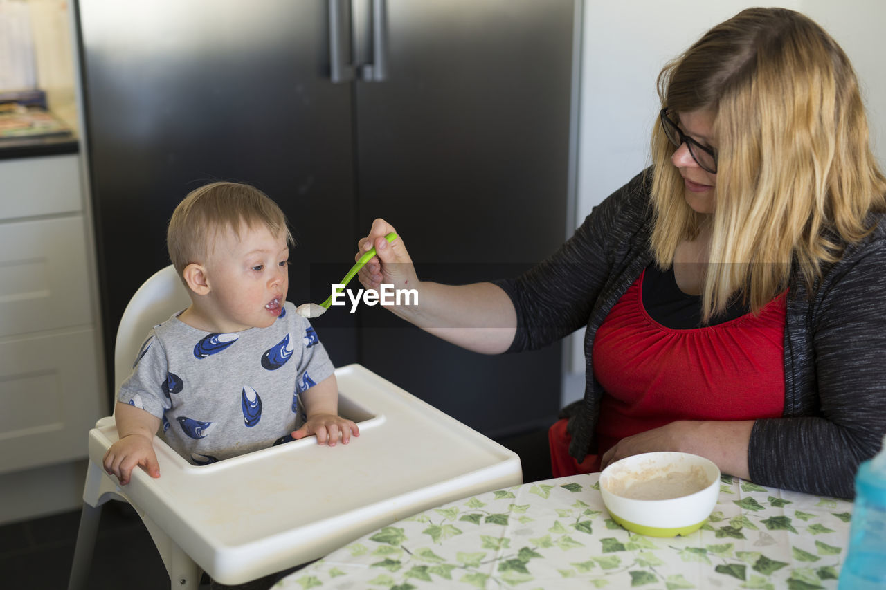 Mother feeding son