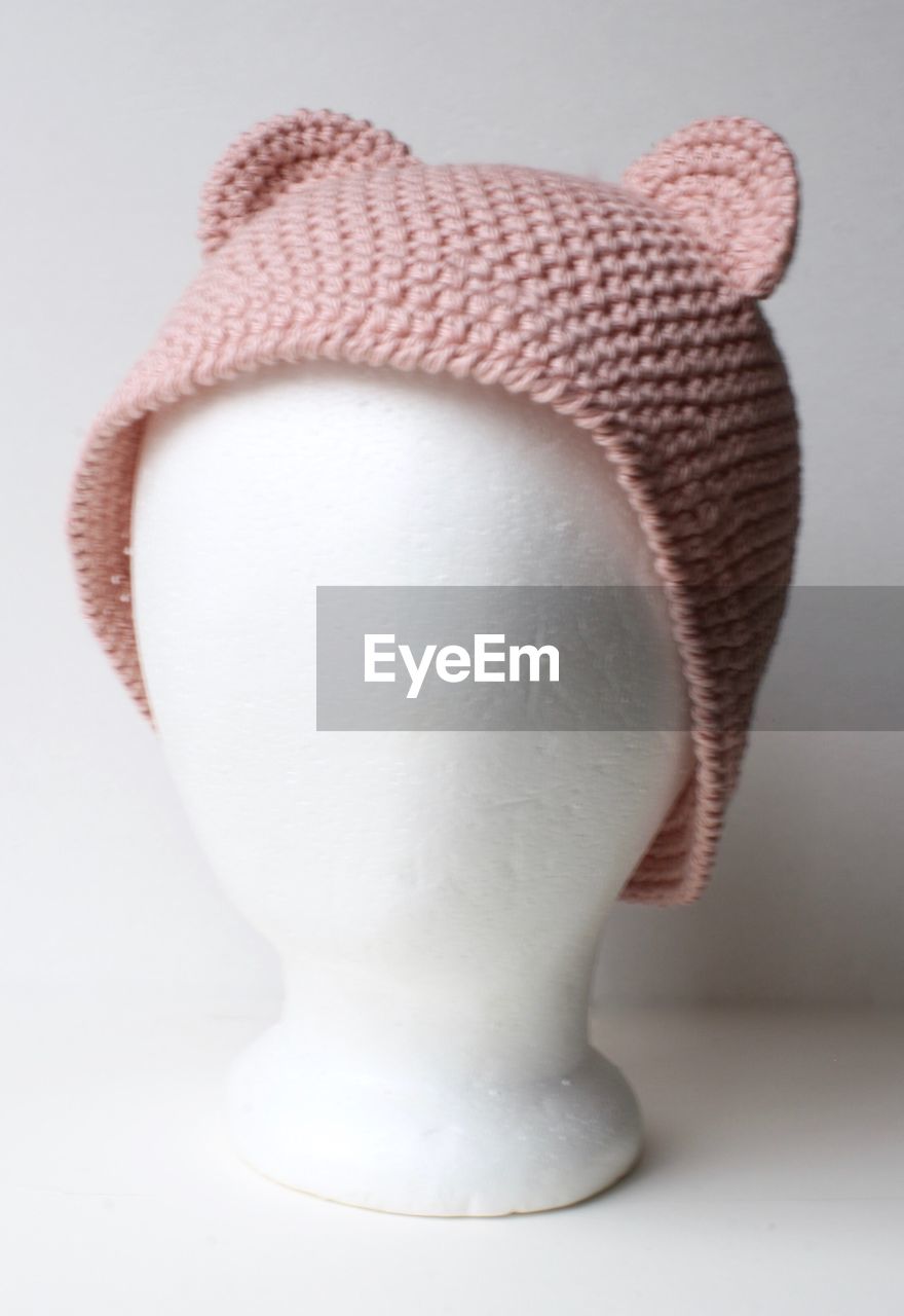 Pink hat against white background