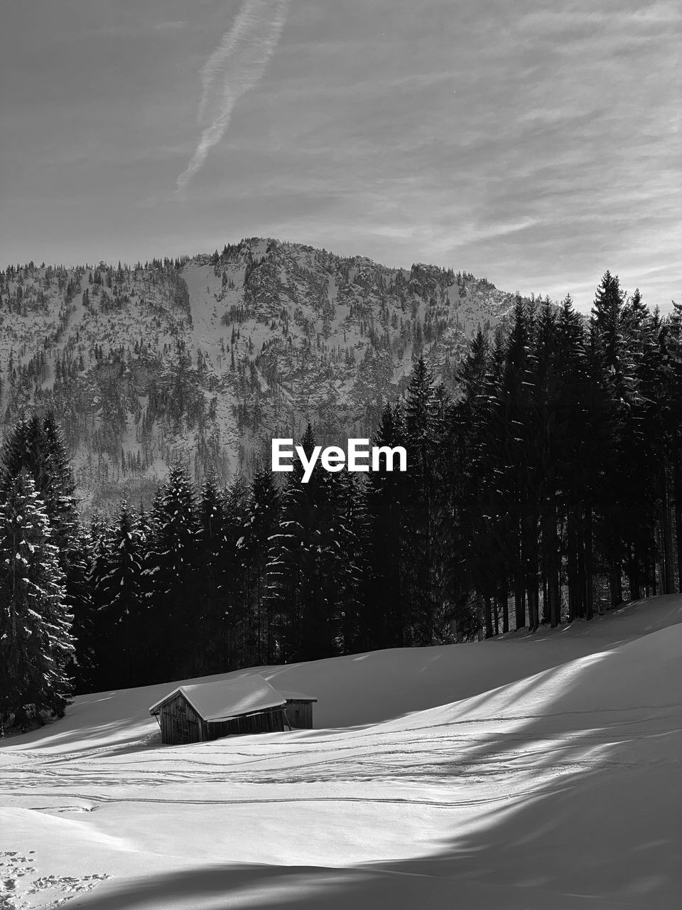 Scenic view of snow covered mountains against sky