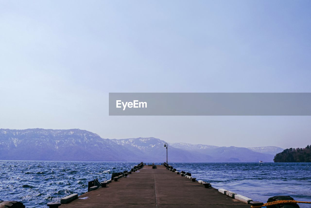 PIER ON SEA AGAINST SKY