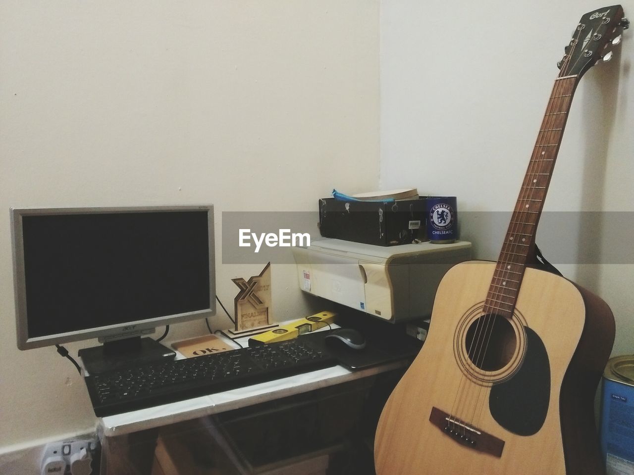 GUITAR ON TABLE BY HOME