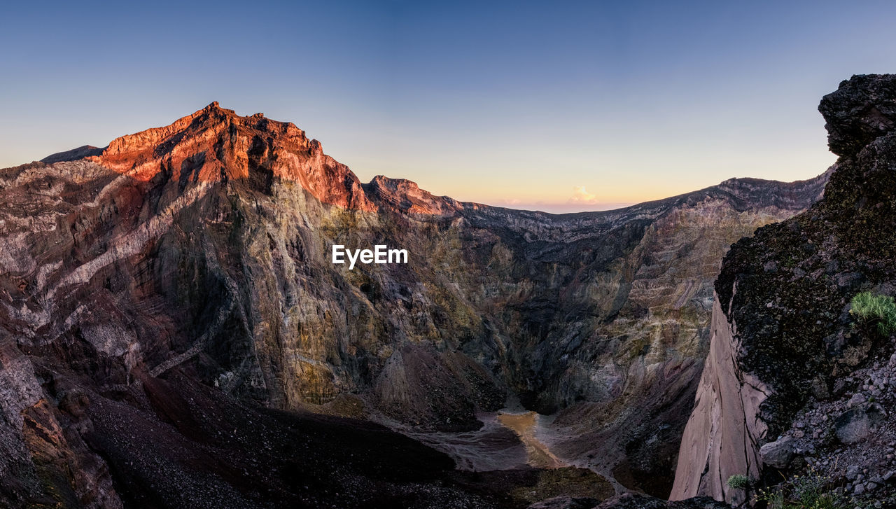 Scenic view of mountain against sky during sunset