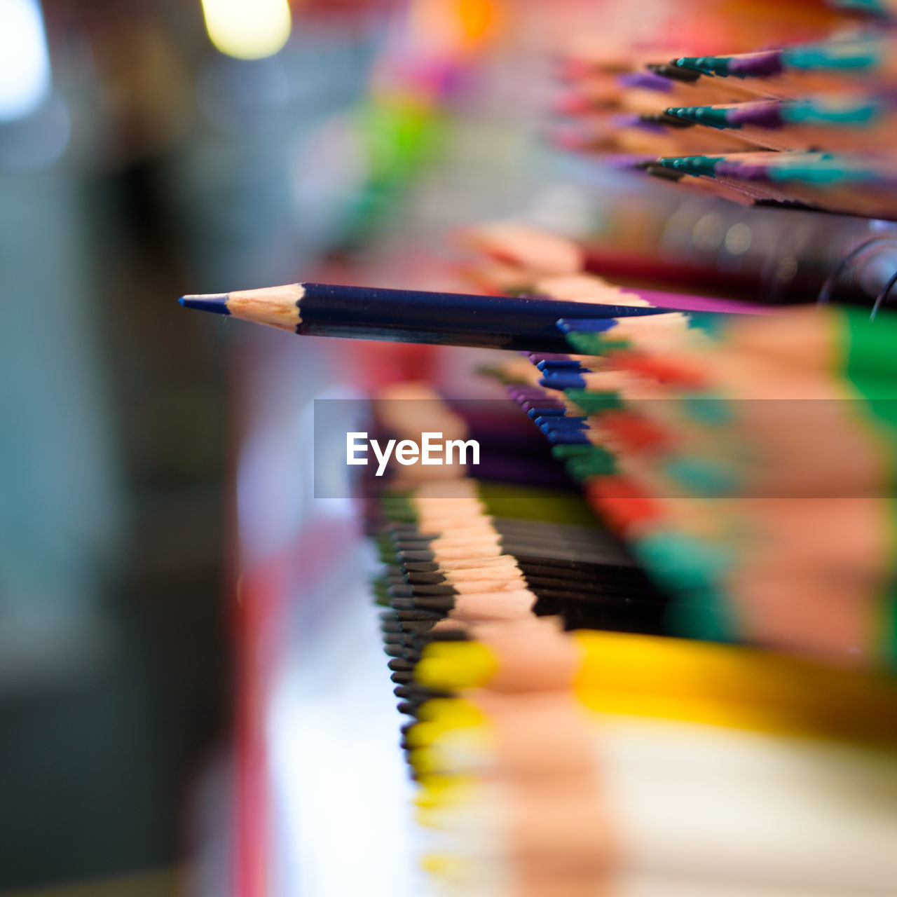 Close-up of colored pencils in row