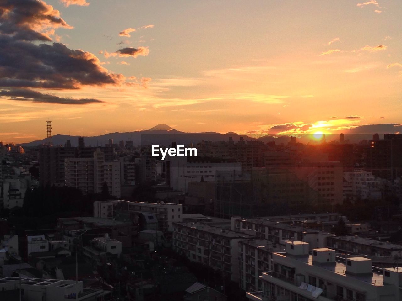 Cityscape against sky during sunset